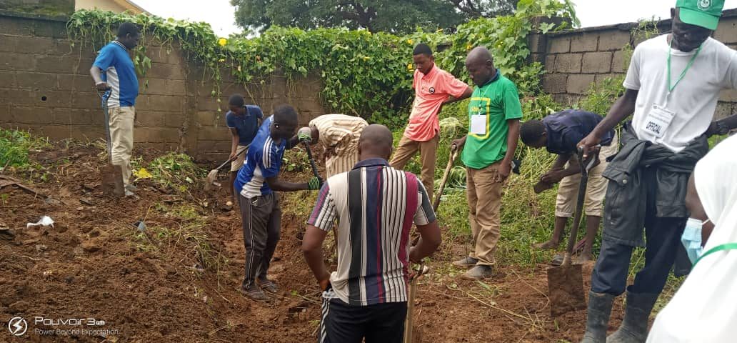 Volunteers at a GNAHC community sanitation exercise